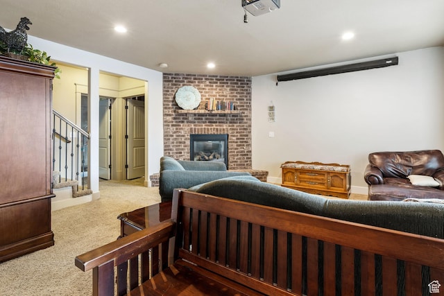 1035 E 300 S, Santaquin, UT 84655 - living room featuring a brick fireplace, carpet, stairs, and recessed lighting