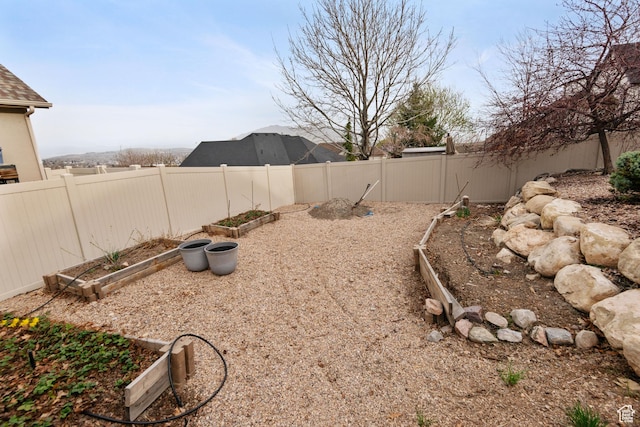 1035 E 300 S, Santaquin, UT 84655 - view of yard featuring a fenced backyard and a vegetable garden
