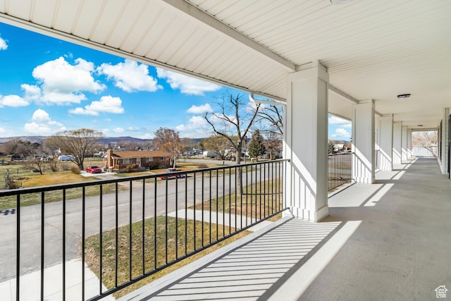 balcony featuring a mountain view and a residential view