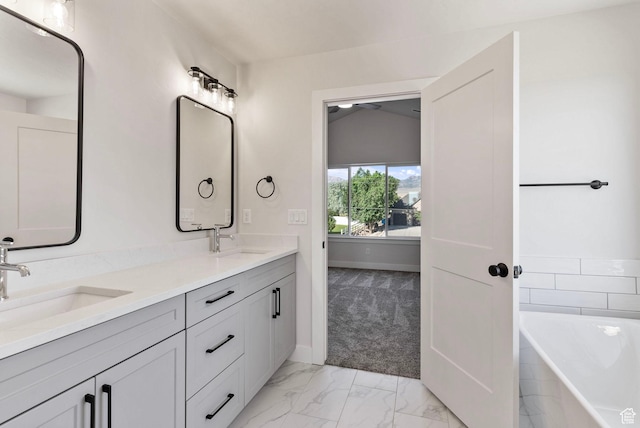 552 41st St, South Ogden, UT 84403 - bathroom with double vanity, a sink, marble finish floor, and a bathtub