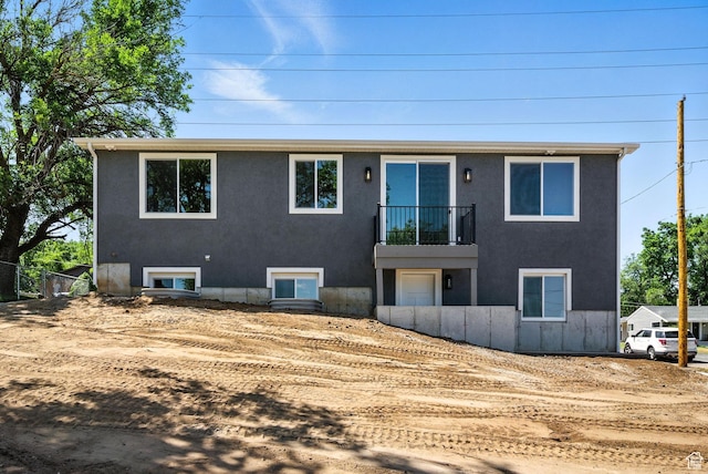 552 E 41st St, South Ogden, UT 84403 - view of front of house with a balcony and stucco siding