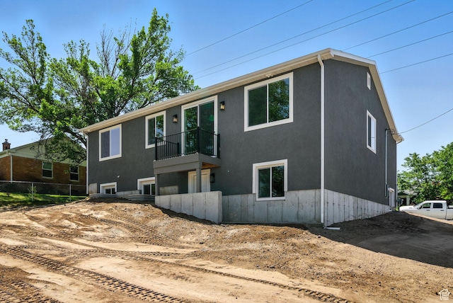 552 E 41st St, South Ogden, UT 84403 - view of front of house with a balcony and stucco siding
