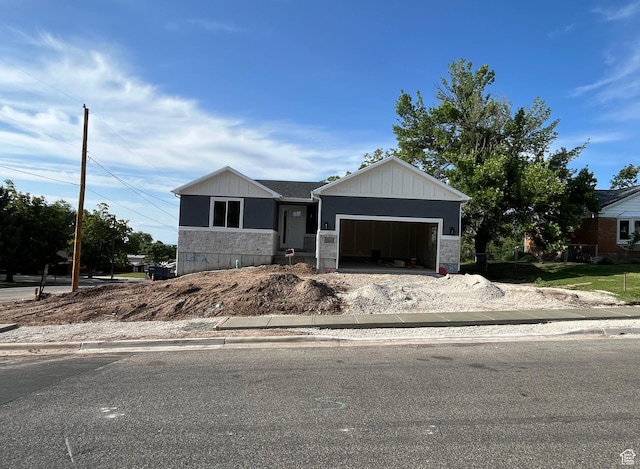552 41st St, South Ogden, UT 84403 - view of front of property featuring stone siding, a garage, and driveway