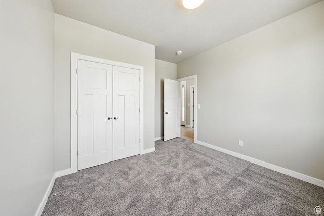 552 E 41st St, South Ogden, UT 84403 - unfurnished bedroom featuring carpet floors and a closet