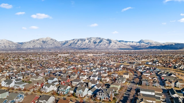 birds eye view of property featuring a mountain view and a residential view