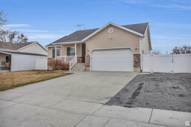 162 S 500 W, Tremonton, UT 84337 - ranch-style home featuring a gate, fence, an attached garage, covered porch, and concrete driveway