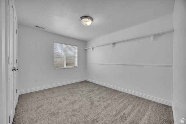 162 S 500 W, Tremonton, UT 84337 - carpeted spare room featuring visible vents, a textured ceiling, and baseboards