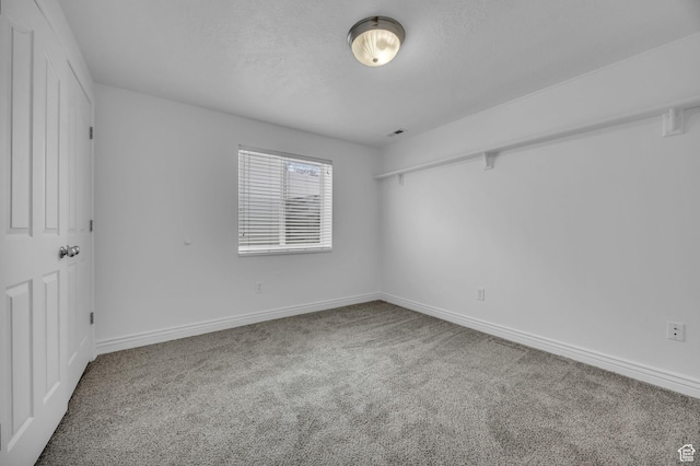 162 S 500 W, Tremonton, UT 84337 - carpeted empty room with baseboards and a textured ceiling