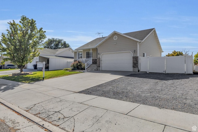 162 S 500 W, Tremonton, UT 84337 - ranch-style house featuring a front lawn, fence, a garage, driveway, and a gate