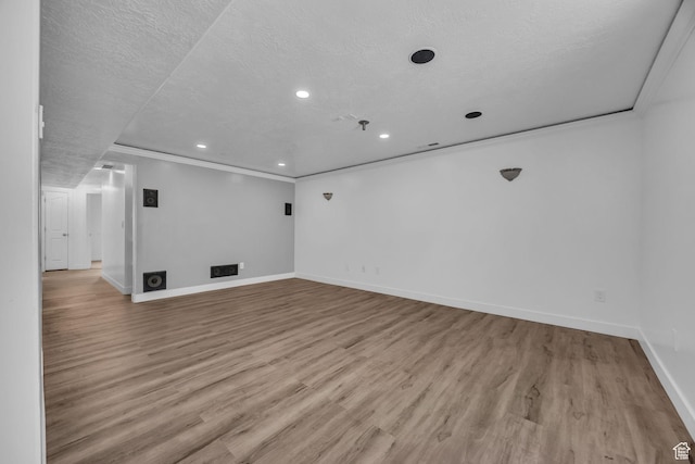 162 S 500 W, Tremonton, UT 84337 - unfurnished room featuring crown molding, baseboards, recessed lighting, wood finished floors, and a textured ceiling