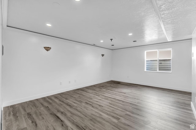162 S 500 W, Tremonton, UT 84337 - empty room with recessed lighting, baseboards, a textured ceiling, and wood finished floors