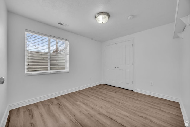 162 S 500 W, Tremonton, UT 84337 - empty room featuring visible vents, baseboards, and wood finished floors