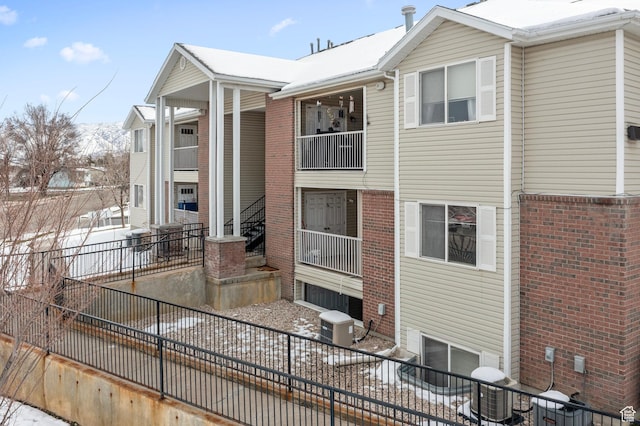 137 W 600 N Unit 205, Tooele, UT 84074 - view of front of house with brick siding, central air condition unit, and fence