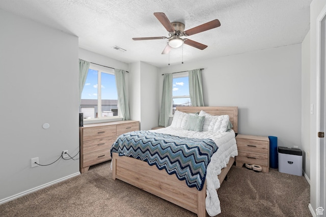 137 W 600 N Unit 205, Tooele, UT 84074 - bedroom featuring a ceiling fan, light colored carpet, visible vents, and a textured ceiling
