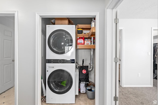 137 W 600 N Unit 205, Tooele, UT 84074 - clothes washing area with laundry area, carpet flooring, stacked washer / drying machine, and a textured ceiling