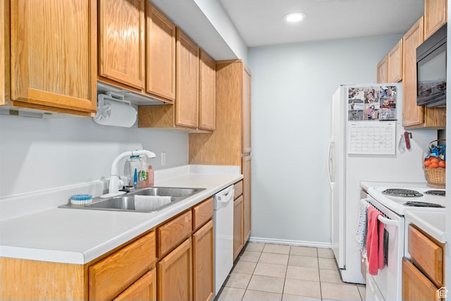 137 W 600 N Unit 205, Tooele, UT 84074 - kitchen with a sink, white appliances, light tile patterned flooring, and light countertops