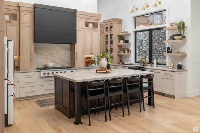 2940 Naomi Dr, North Logan, UT 84341 - kitchen featuring open shelves, a sink, light wood-type flooring, decorative backsplash, and a high ceiling