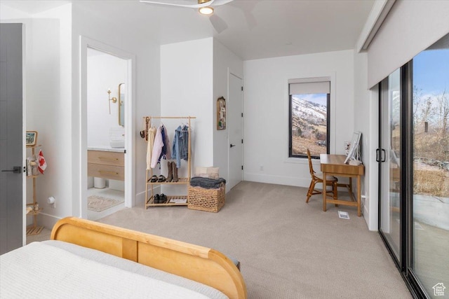 2940 Naomi Dr, North Logan, UT 84341 - bedroom with light colored carpet, baseboards, access to exterior, ensuite bath, and ceiling fan