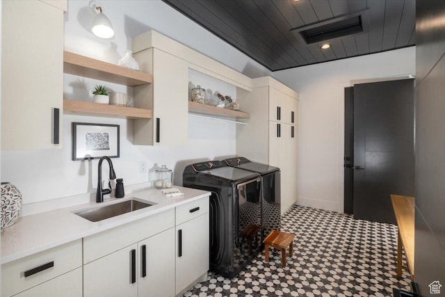 2940 Naomi Dr, North Logan, UT 84341 - washroom featuring separate washer and dryer, cabinet space, tile patterned floors, and wood ceiling