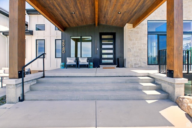 2940 Naomi Dr, North Logan, UT 84341 - doorway to property featuring stone siding, board and batten siding, and covered porch