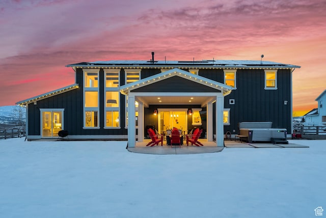 165 E Wasatch Way, Snyderville, UT 84098 - rear view of house with french doors, a patio area, board and batten siding, solar panels, and a hot tub