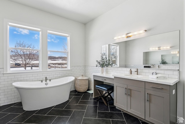 165 E Wasatch Way, Snyderville, UT 84098 - full bathroom with tile patterned flooring, tile walls, wainscoting, a freestanding tub, and vanity