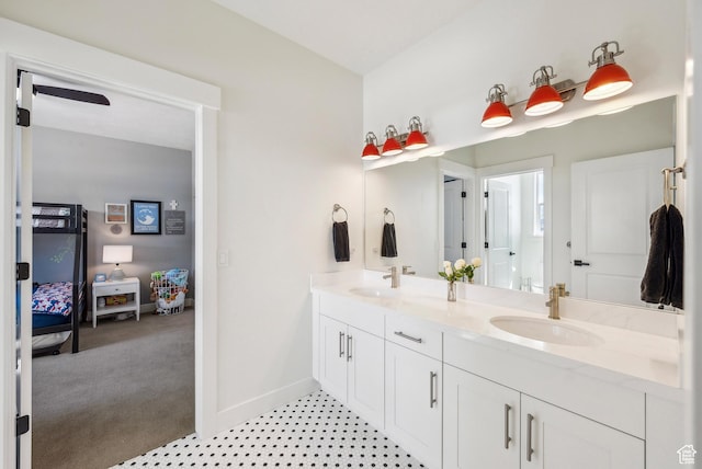 165 E Wasatch Way, Snyderville, UT 84098 - bathroom featuring double vanity, ensuite bathroom, baseboards, and a sink