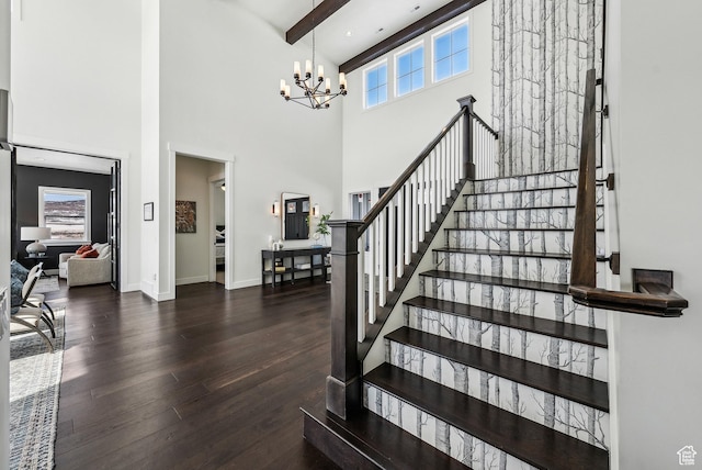 165 E Wasatch Way, Snyderville, UT 84098 - staircase featuring beamed ceiling, wood finished floors, a high ceiling, an inviting chandelier, and baseboards