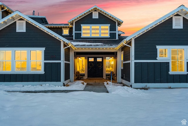 165 E Wasatch Way, Snyderville, UT 84098 - view of front facade with french doors, roof with shingles, board and batten siding, and a sunroom