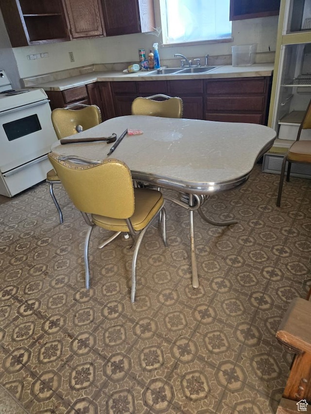 221 E Sr 24, Loa, UT 84747 - kitchen featuring a sink, white electric range oven, and light countertops