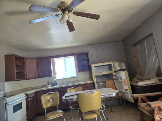 221 E Sr 24, Loa, UT 84747 - kitchen featuring open shelves, ceiling fan, white electric range oven, and light countertops