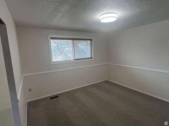 916 E Sunburn Ln, Sandy, UT 84094 - spare room with visible vents, a textured ceiling, baseboards, and dark colored carpet