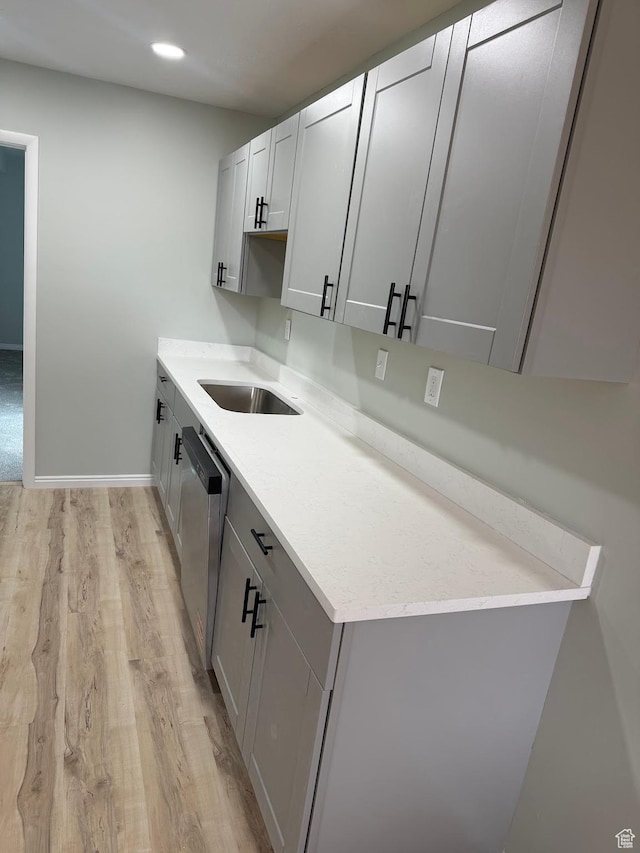 916 E Sunburn Ln, Sandy, UT 84094 - kitchen with baseboards, dishwasher, recessed lighting, light wood-style flooring, and a sink