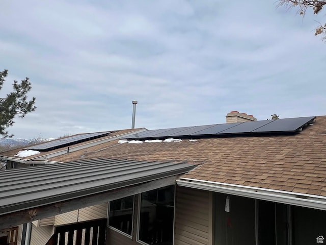 916 E Sunburn Ln, Sandy, UT 84094 - details with roof with shingles and a chimney