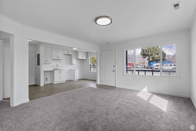 154 S 400 E, American Fork, UT 84003 - unfurnished living room with a sink, visible vents, baseboards, and carpet
