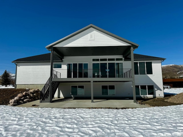 3151 E 5225 N Unit 11, Liberty, UT 84310 - snow covered rear of property featuring a patio area and stairs