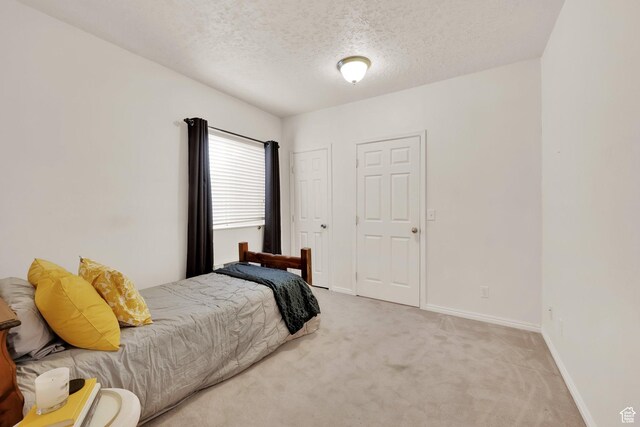 8851 S Humboldt Ct W, West Jordan, UT 84081 - carpeted bedroom with a textured ceiling and baseboards