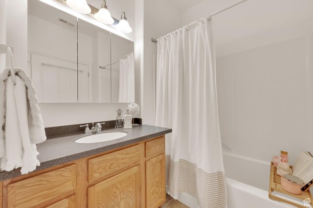 8851 S Humboldt Ct W, West Jordan, UT 84081 - bathroom with vanity and shower / bath combo with shower curtain