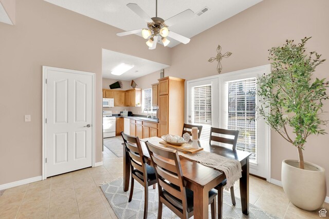 8851 S Humboldt Ct W, West Jordan, UT 84081 - dining area with a ceiling fan, light tile patterned flooring, and a high ceiling