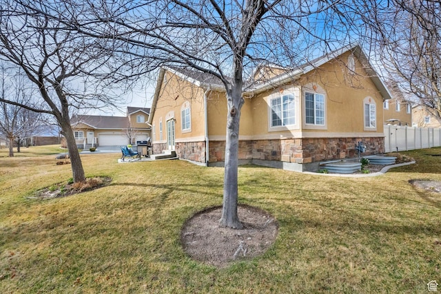 8851 S Humboldt Ct W, West Jordan, UT 84081 - view of property exterior featuring stone siding and stucco siding