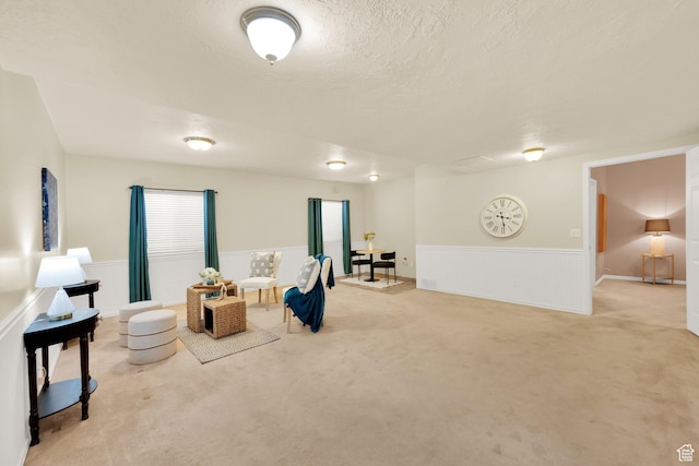 8851 S Humboldt Ct W, West Jordan, UT 84081 - living area with carpet, wainscoting, and a textured ceiling