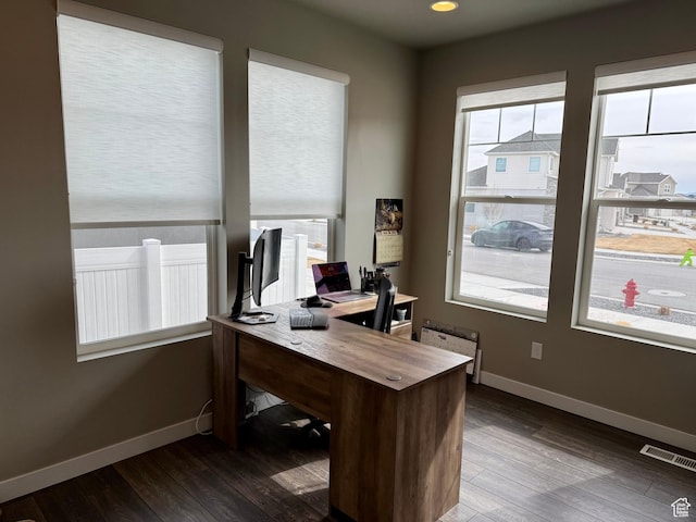 office featuring visible vents, baseboards, and dark wood-style flooring