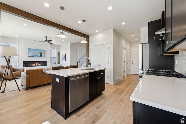 6005 N Westridge Rd, Heber City, UT 84032 - kitchen with light countertops, light wood-style flooring, ceiling fan, stainless steel appliances, and a sink