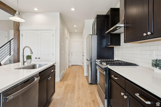 6005 N Westridge Rd, Heber City, UT 84032 - kitchen with light countertops, a sink, stainless steel appliances, and tasteful backsplash