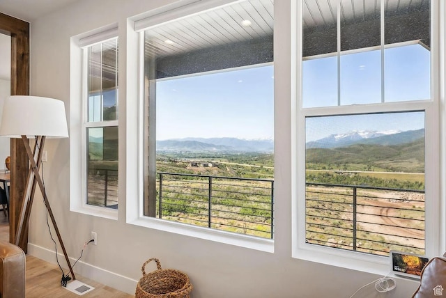6005 N Westridge Rd, Heber City, UT 84032 - room details with baseboards, a mountain view, and wood finished floors