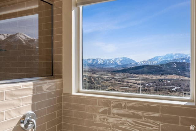 6005 N Westridge Rd, Heber City, UT 84032 - bathroom with a tile shower, a mountain view, and a healthy amount of sunlight