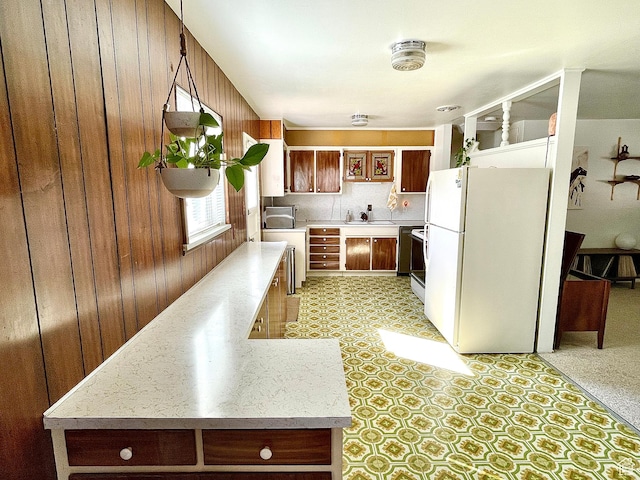 1653 W 80 S, Provo, UT 84601 - kitchen with dishwashing machine, freestanding refrigerator, a sink, light countertops, and wood walls