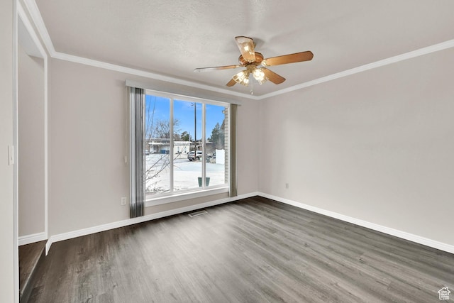 empty room with baseboards, dark wood-style floors, ceiling fan, and visible vents