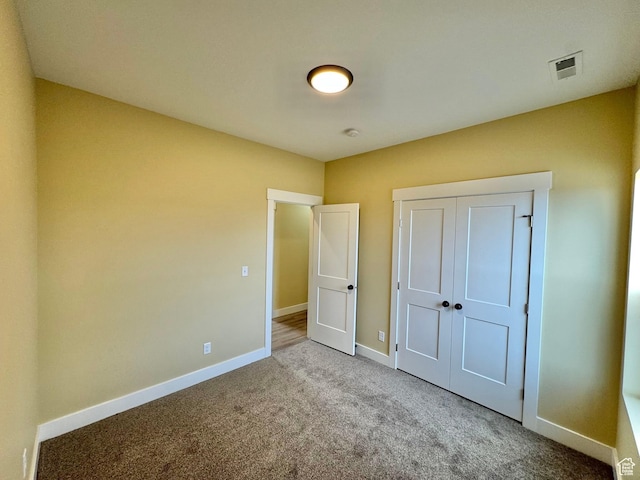18136 N 6000 W, Garland, UT 84312 - unfurnished bedroom featuring carpet, baseboards, and visible vents