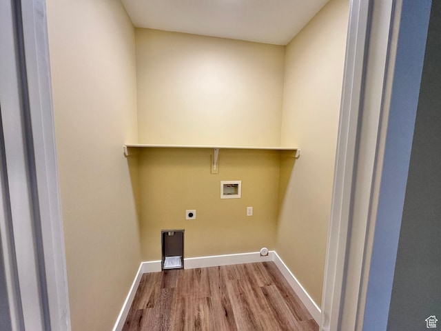 18136 N 6000 W, Garland, UT 84312 - washroom featuring wood finished floors, baseboards, laundry area, electric dryer hookup, and washer hookup